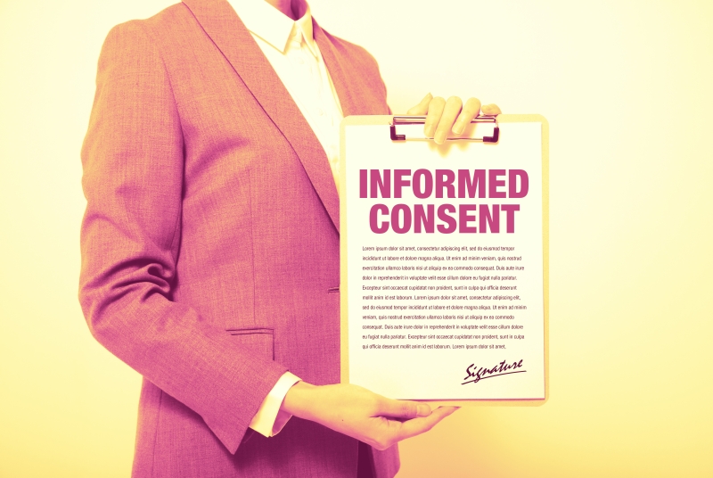 Stock photo of official displaying an informed consent agreement.